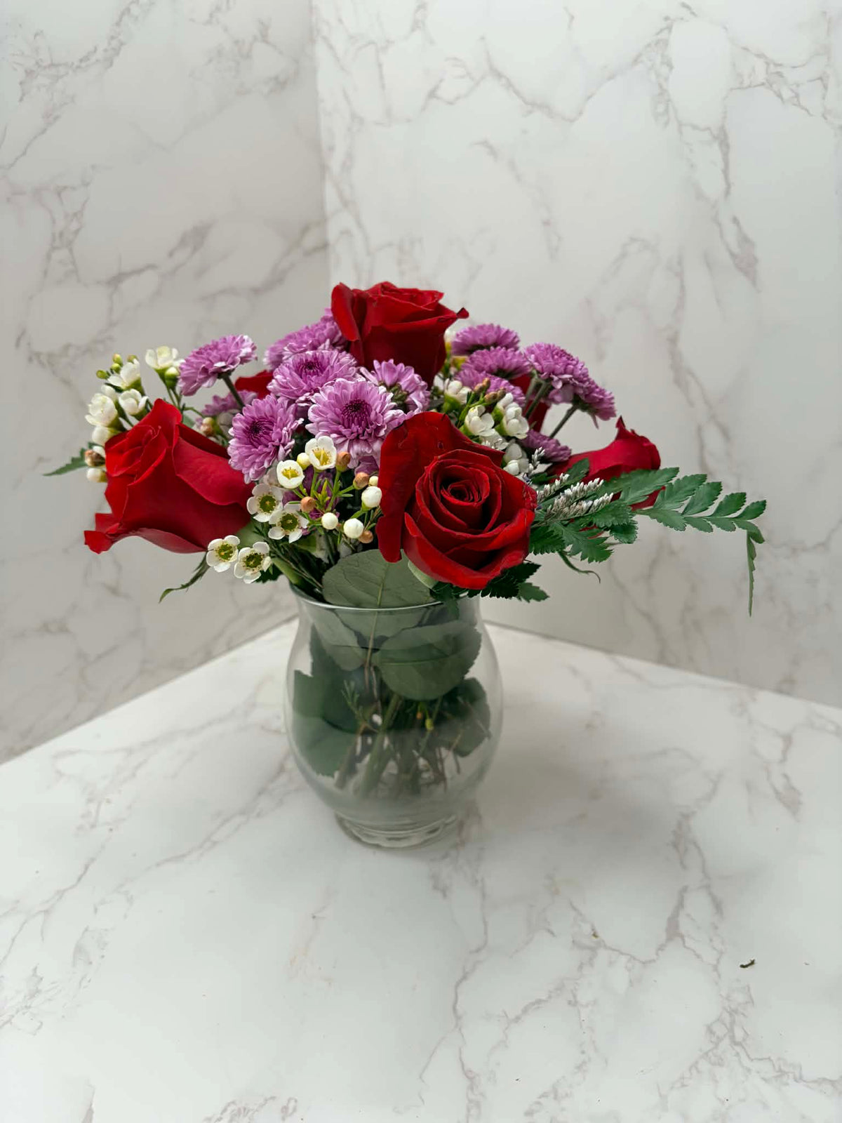 Rose Runners petite red rose and purple chrysanthemum arrangement in a clear glass vase
